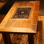 Деревянный стол с кованной решеткой посредине